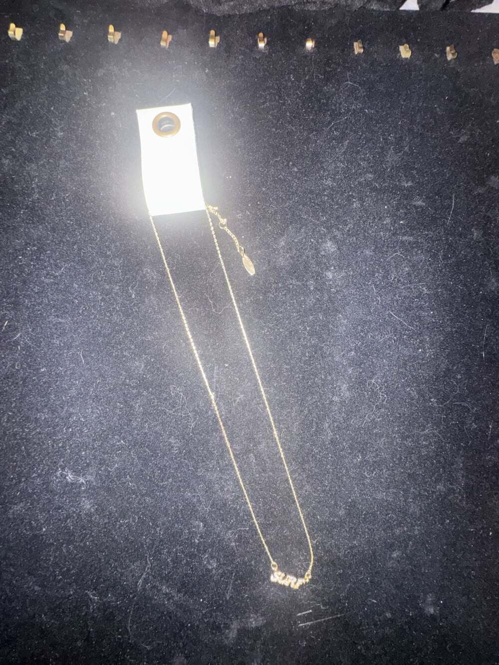 Serafina SURF Word Pendant Necklace with Cubic Zirconia Stones in Gold Tone
